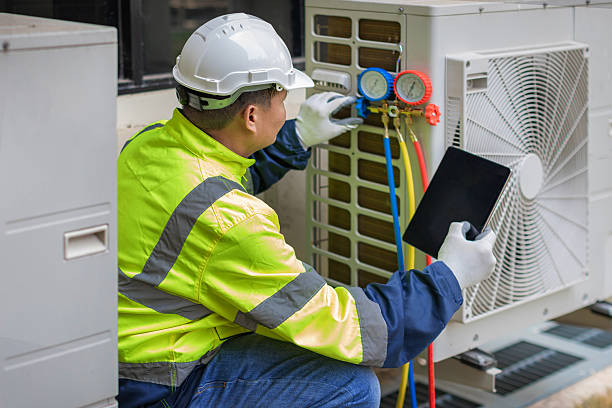 Professional Heat Pump Repair technician working in Fayville, MA